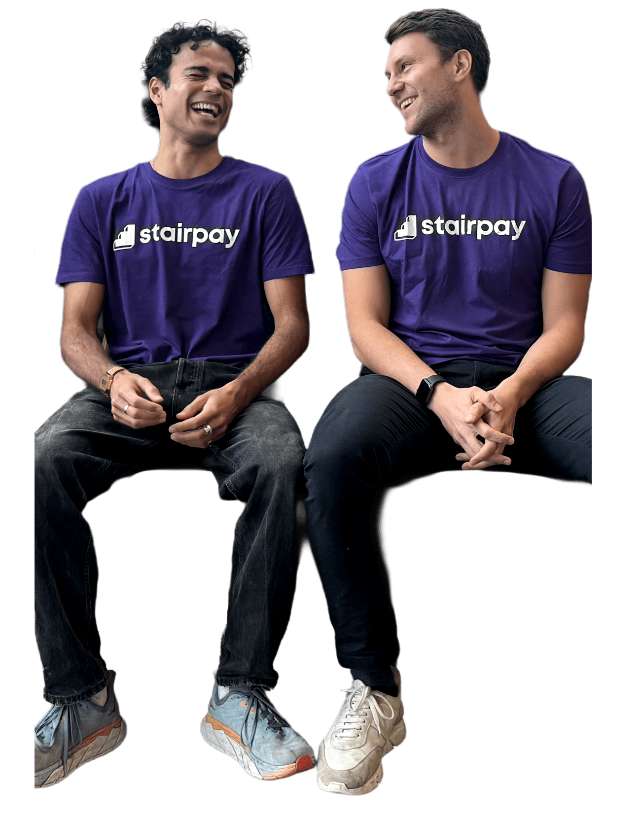 Two of the Stairpay team sitting on a bench, laughing